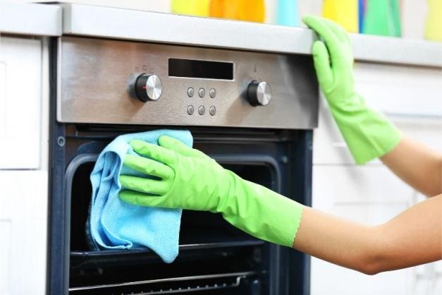 Home shutterstock woman hands protective gloves cleaning oven 391063411